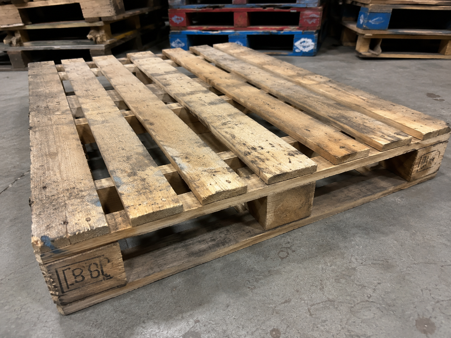 A repaired 48 by 40 reclaimed wood pallet